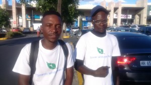 On left is Clarence Tapfuma (26) with Zimbabwean co-founder of Dynamic Windscreen Tech Spencer Banda (29) after fixing damaged cars' windscreen dents, chips and cracks. Photo by Savious Kwinika, CAJ News Africa