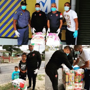 Stellenbosch FC players donating food parcels to the need