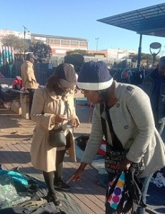 South African young lady, Miss Lumka Dhlamini (left), a holder of Jewellery Design and Manufacturing degree is seen here selling jerseys and jackets outside Pan Africa Mall in Alexandra. Photo by Savious Kwinika, CAJ News