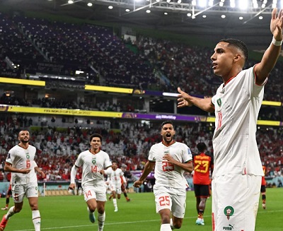 Morocco's midfielder #11 Abdelhamid Sabiri (front) celebrates with teammates after he scored his team's first goal during the Qatar 2022 World Cup Group F football match between Belgium and Morocco at the Al-Thumama Stadium in Doha. Photo: Getty Images