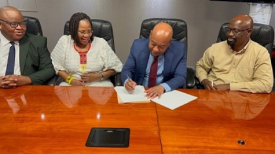 PHOTO CAPTION: From left far right is South Africa Tourism Acting Chief Executive Officer (CEO), Themba Mzilikazi Khumalo signing the Indaba three-year contract. He is flanked by Nhlanhla Khumalo, Acting CEO of Tourism KZN (second from far right), EThekwini City Manager, Musa Mbhele (far left) and Inkosi Albert Luthuli International Convention Centre CEO, Lindiwe Rakharebe. Photo supplied 
