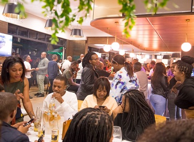 Customers throng the newly opened News Café in Davenport, Durban.