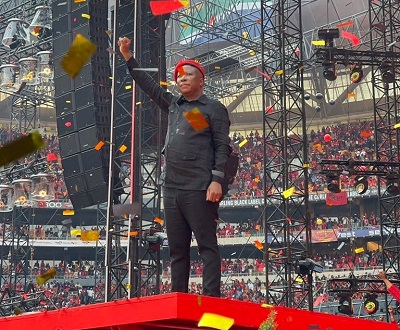 Lifting his hand in show of power, Economic Freedom Fighters (EFF) CIC Julius Malema address the party's 10th Anniversary at the FNB Stadium in Johannesburg, South Africa
