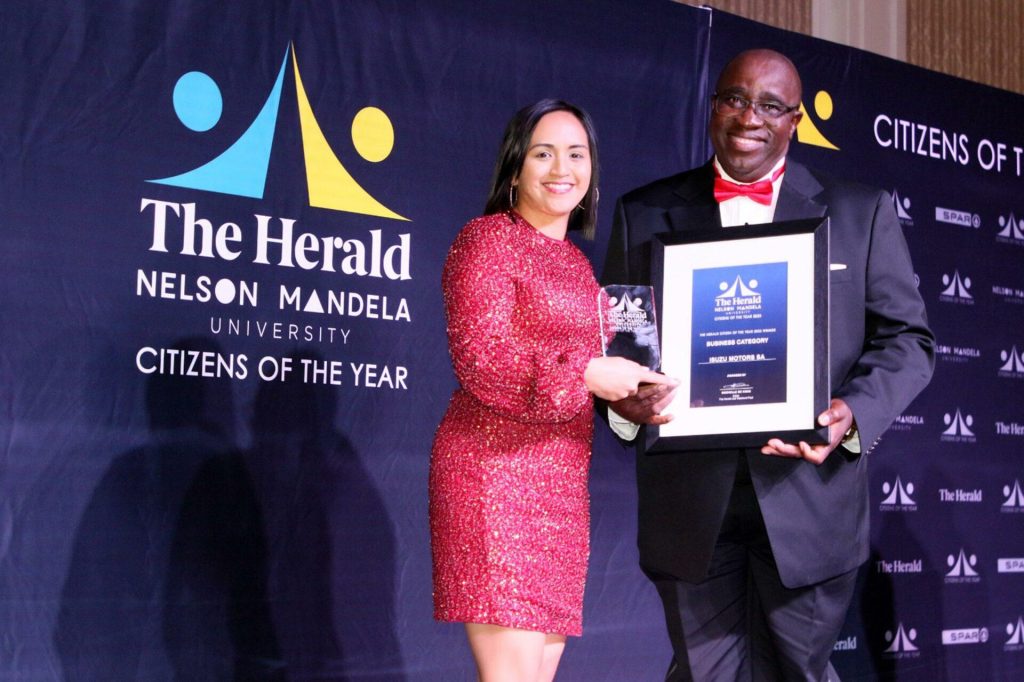 ISUZU Motors South Africa, Senior Vice President Mongezi Hermans receives the Citizen of the year award (Business Category), from Berna Ulay-Walters, The Herald's Marketing Manager.