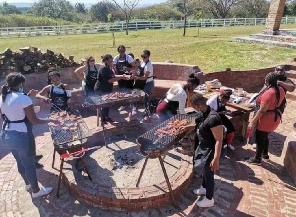 Play On Mzansi team busy roasting meat for customers